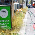 Photo illustration of curbside pickup in city with roadmap element