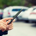 Using a smartphone in a parking lot