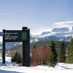 Dynamic sign outside Breckenridge, with mountain in background
