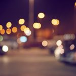 An urban parking lot at night, out of focus