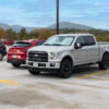 A large pickup truck fills a parking space
