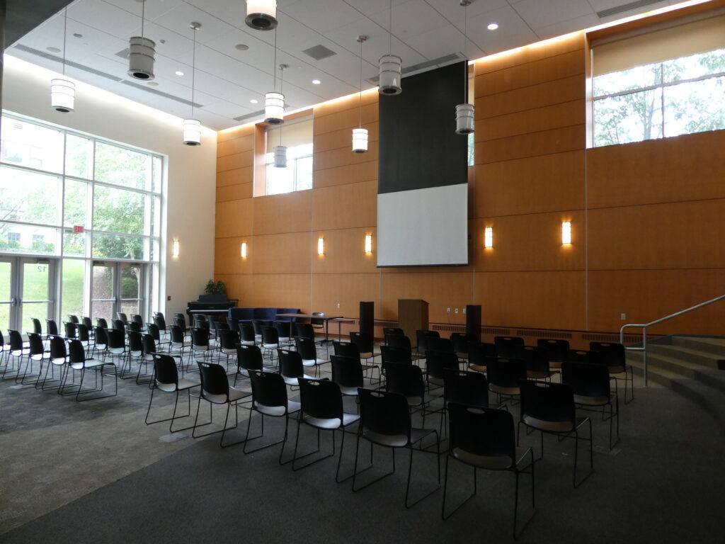 Interior of an event hall with chairs sets up in a classroom configuration